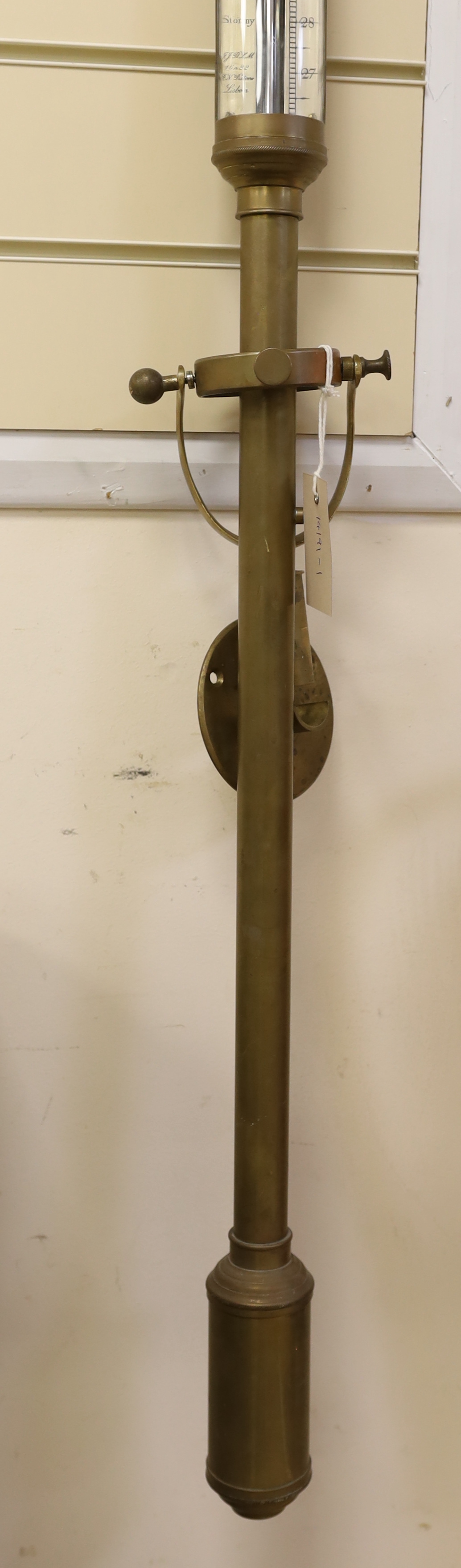 An early twentieth century marine barometer with a brass body mounted on a gimbal by R.N. Desterre, Lisbon, 93cm